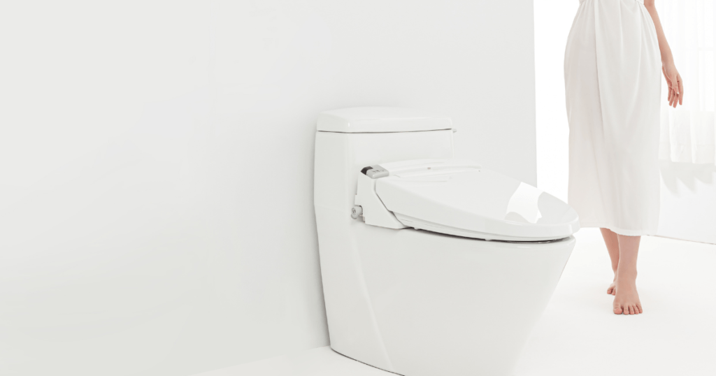 Smart Toilet Features- A sleek, modern toilet with a digital control panel, automatic flushing, and built-in bidet and air dryer. LED lights illuminate the interior, and sensors detect when the user approaches