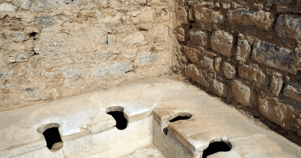 When Was the Toilet Seat Invented-old stone toilet 