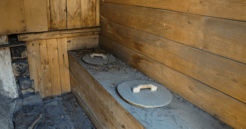 When Was the Toilet Seat Invented-old stone toilet 